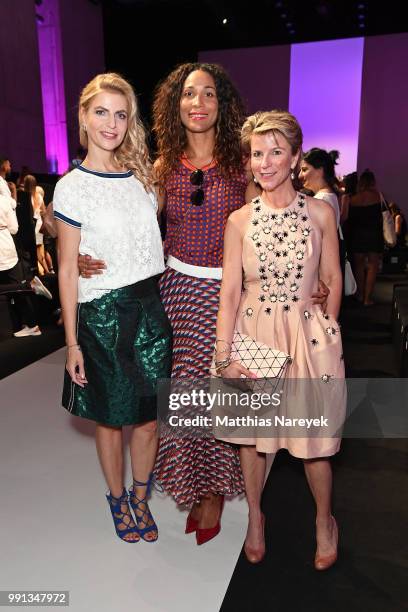 Tanja Buelter, Annabelle Mandeng and a guest attend the Rebekka Ruetz show during the Berlin Fashion Week Spring/Summer 2019 at ewerk on July 4, 2018...