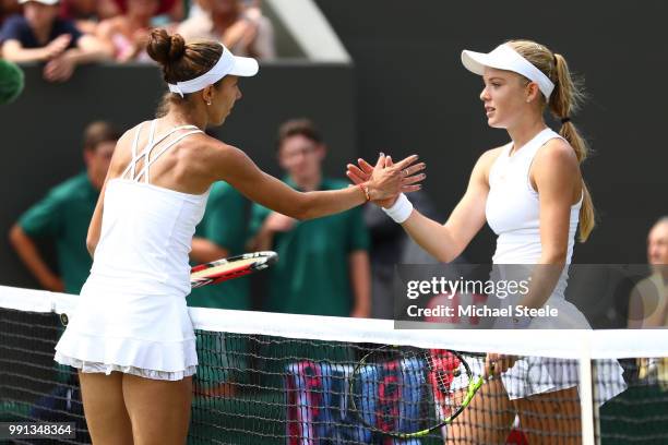 Katie Swan of Great Britain shakes hands with Mihaela Buzarnescu of Romania after their Ladies' Singles second round match on day three of the...