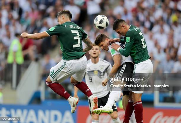 Carlos Salcedo of Mexico Mario Gomez of Germany Hirving Lozano of Mexico during the 2018 FIFA World Cup Russia group F match between Germany and...