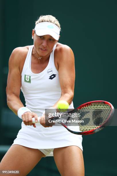 Yanina Wickmayer of Belgium returns against Andrea Petkovic of Germany during their Ladies' Singles second round match on day three of the Wimbledon...