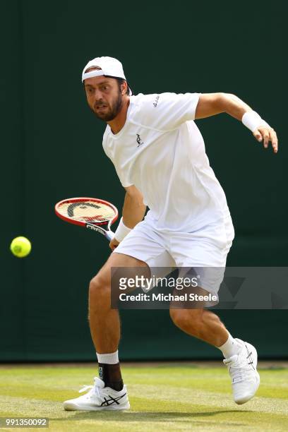 Paolo Lorenzi of Italy returns against Gael Monfils of France during their Men's Singles second round match on day three of the Wimbledon Lawn Tennis...