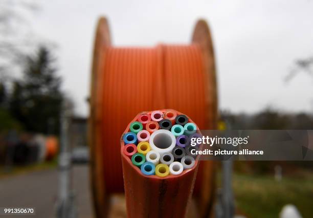 Cable drum with tubes for broadband cables stand on a construction site in Westerroenfeld, Germany, 9 November 2017. The government at that time...