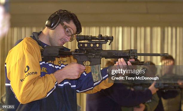 John Eales of The Wallabies fires a gun during a training session with the SAS at Campbell Barracks in Perth, Australia. DIGITAL IMAGE Mandatory...