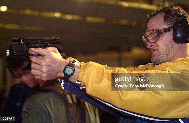 Mark Connors of The Wallabies fires a gun during a training session with the SAS at Campbell Barracks in Perth, Australia. DIGITAL IMAGE Mandatory...