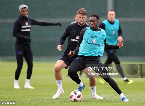 Danny Welbeck holds off Gary Cahill during an England training session on July 4, 2018 in Saint Petersburg, Russia.