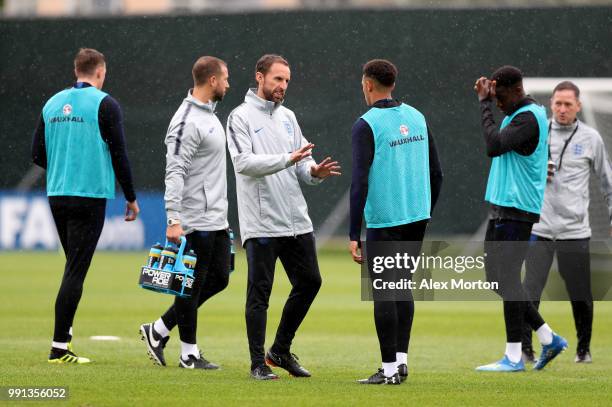 England manager, Gareth Southgate speaks with Trent Alexander-Arnold during an England training session on July 4, 2018 in Saint Petersburg, Russia.