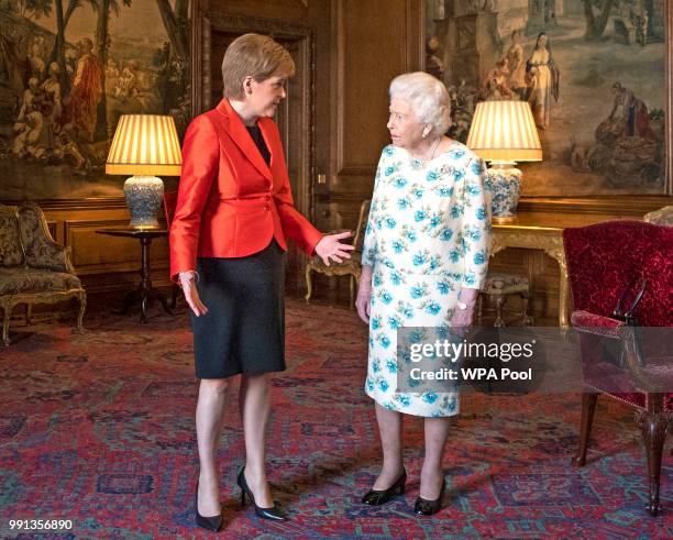 Queen Elizabeth II meets with Scotland's First Minister Nicola Sturgeon during a private audience at the Palace of Holyrood House on July 4, 2018 in...