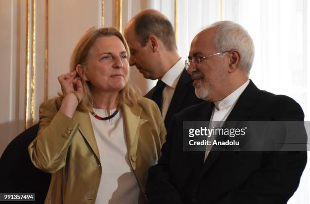 Iranian Foreign Minister Mohammad Javad Zarif and Austrian Foreign Minister Karin Kneissl are seen as Austrian President Alexander Van der Bellen and...