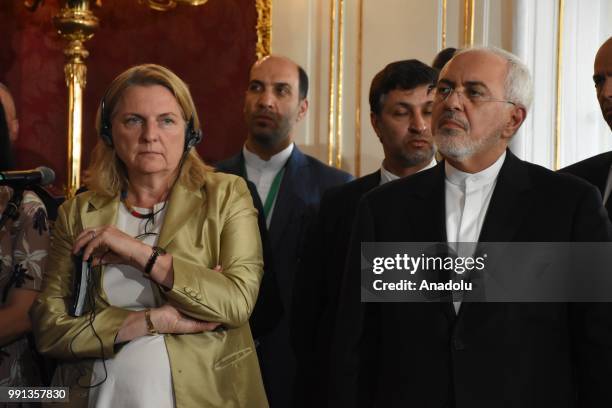 Iranian Foreign Minister Mohammad Javad Zarif and Austrian Foreign Minister Karin Kneissl are seen as Austrian President Alexander Van der Bellen and...