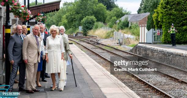 Camilla, Duchess of Cornwall and Prince Charles, Prince of Wales during a visit to Llandovery Train Station on July 4, 2018 in Llandovery, Wales.