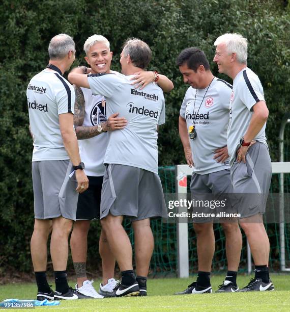 July 2018, Germany, Frankfurt/Main: Soccer, Bundesliga, beginning of training for Eintracht Frankfurt. Carlos Salcedo greets manager Adi Huetter,...