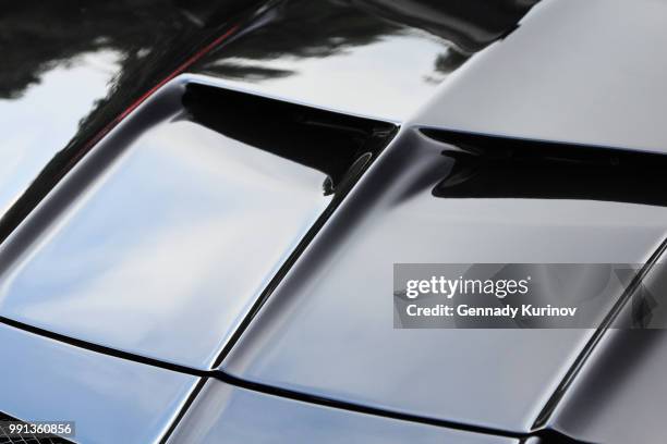 black sports car hood - ['sports car' stock pictures, royalty-free photos & images