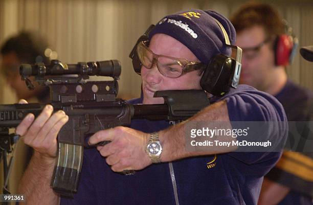 Nathan Grey of The Wallabies fires a gun during a training session with the SAS at Campbell Barracks in Perth, Australia. DIGITAL IMAGE Mandatory...
