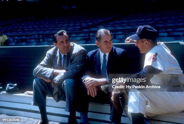 General Manager Hank Greenberg and Al Rosen of the Cleveland Indians talk with an unidentified man before an MLB game against the Chicago White Sox...