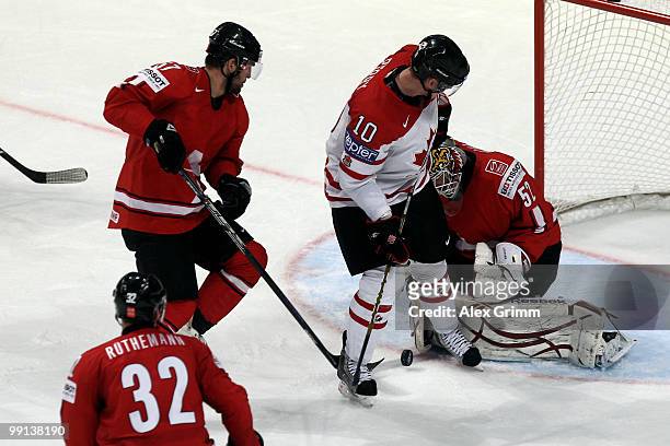 Corey Perry of Canada tries to score against goalkeeper Tobias Stephan of Switzerland during the IIHF World Championship group C match between Canada...