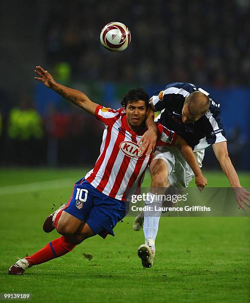 Sergio Aguero of Atletico Madrid and Breda Hangeland of Fulham battle for the ball during the UEFA Europa League final match between Atletico Madrid...