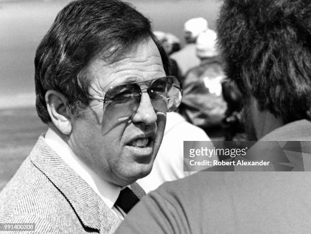 Bill France, Jr., the chief executive officer of NASCAR, talks with friends and others in the garage area at Daytona International Speedway in...