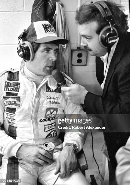 Prior to the start of the 1982 Daytona 500 auto race, NASCAR driver Darrell Waltrip is interviewed by MRN radio reporter Dr. Jerry Punch in the...