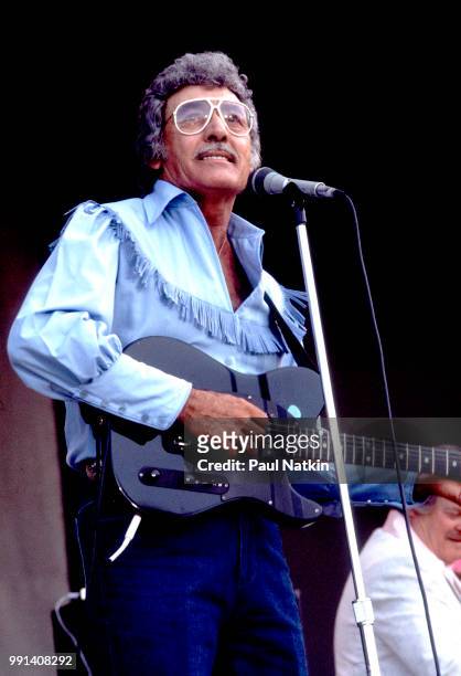 American singer Carl Perkins performs on stage at the Petrillo Bandshell in Chicago, Illinois, June 7, 1987.