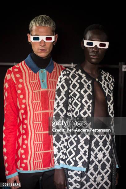 Models wait backstage before a show with the South African designer label Makhosa on March 23, 2018 at Cape Town film studios, South Africa. South...