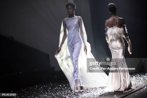 Models walk during a show with the South African designers KLuk CGDT on August 17, 2017 in Mall of Africa north of Johannesburg, South Africa....