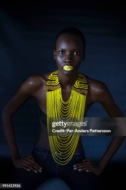 Ugandan model Patricia Akello wears a necklace by the Ugandan label Halisi on January 3 in Cape Town, South Africa. She is one of many models from...
