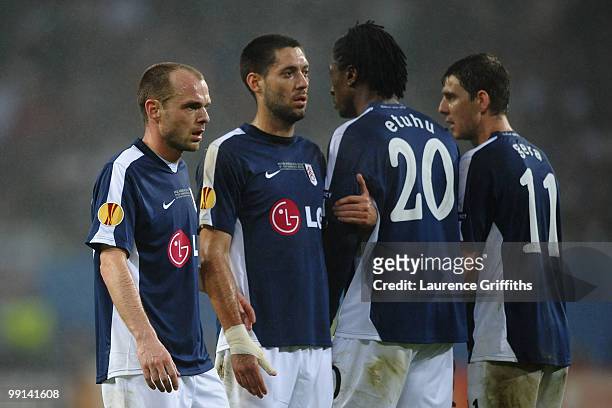 Danny Murphy, Clint Dempsey, Dickson Etuhu and Zoltan Gera of Fulham stand in the wall during the UEFA Europa League final match between Atletico...