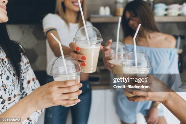 friends drinking iced coffee at home - iced coffee stock pictures, royalty-free photos & images