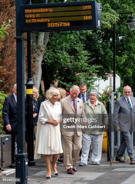 Prince Charles, Prince of Wales and Camilla, Duchess of Cornwall wait for the train to take them to their next engagement at Llandovery Train Station...