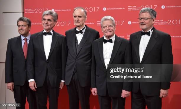 Siemens chairman and award winner Joe Kaeser ,and former president of Germany and award winner Joachim Gauck standing with the head of the Jewish...