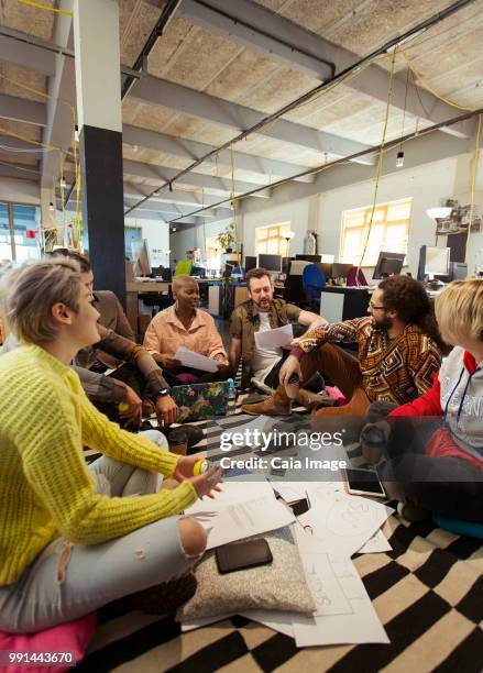 creative business team meeting, brainstorming in circle on office floor - crowdsourcing stock pictures, royalty-free photos & images