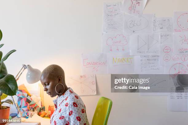 creative businesswoman working at desk in office - vanguardians stock pictures, royalty-free photos & images