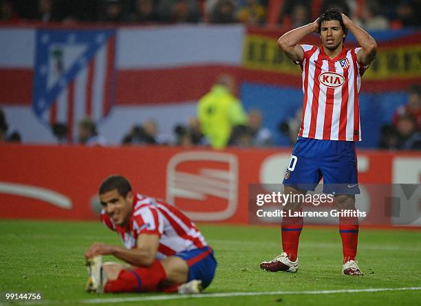 Sergio Aguero of Atletico Madrid reacts while his team mate Alvaro Dominguez stretches during the UEFA Europa League final match between Atletico...