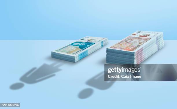 british pound gender pay gap - ten pound note stock pictures, royalty-free photos & images