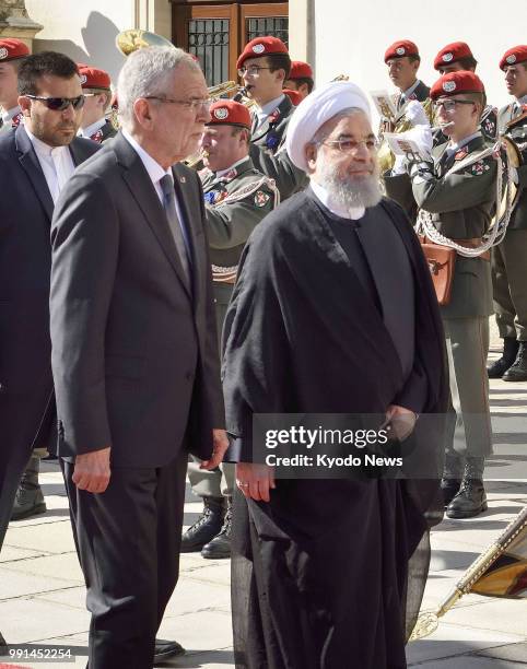 Photo taken on July 4 shows Iranian President Hassan Rouhani and Austrian President Alexander Van der Bellen in Vienna. ==Kyodo