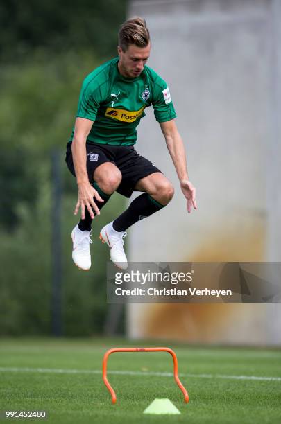 Patrick Herrmann jumps during a training session of Borussia Moenchengladbach at Borussia-Park on July 04, 2018 in Moenchengladbach, Germany.