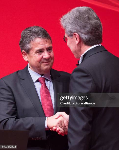 Laudator and foreign minister from The Social Democratic Party of Germany , Sigmar Gabriel and Siemens chairman and award winner Joe Kaeser sitting...