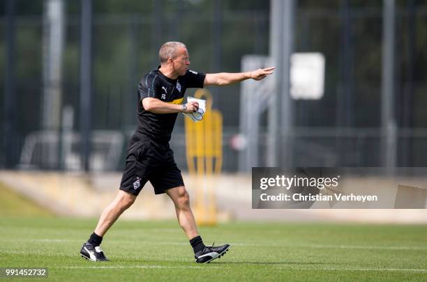 Co- Trainer Frank Geideck gives instructions during a training session of Borussia Moenchengladbach at Borussia-Park on July 04, 2018 in...