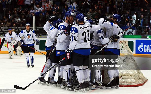 The team of Finland celebrate after winning the IIHF World Championship group A match between Finland and USA at Lanxess Arena on May 12, 2010 in...