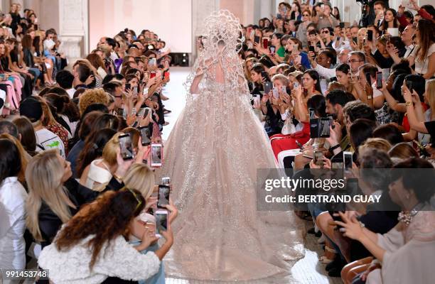 Model presents a creation by Elie Saab during the 2018-2019 Fall/Winter Haute Couture collection fashion show in Paris, on July 4, 2018.