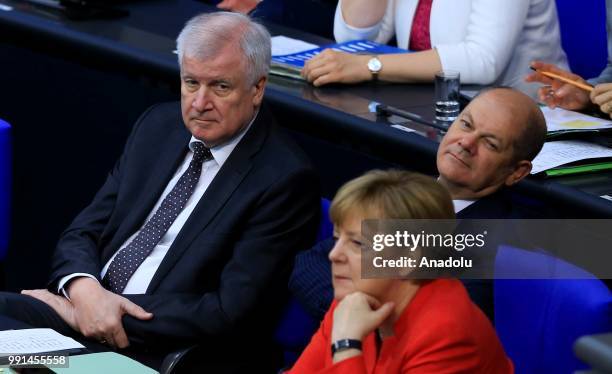 German Chancellor Angela Merkel , German Interior Minister Horst Seehofer and German Finance Minister Olaf Scholz attend a session on the budget at...