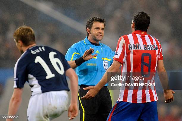 Atletico Madrid's midfielder Raul Garcia argues with Italian Referee Nicola Rizzoli during the final football match of the UEFA Europa League Fulham...