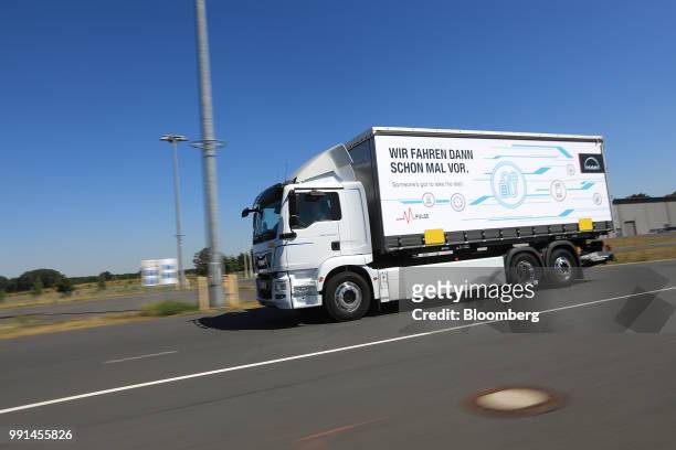 ETruck freight vehicle drives during an electric powered driving demonstration at Berlin ExpoCenter airport exhibition ground in Berlin, Germany, on...