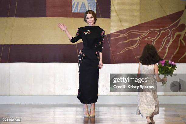 Designer Ulyana Sergeenko acknowledges the audience during the Ulyana Sergeenko Haute Couture Fall Winter 2018/2019 show as part of Paris Fashion...