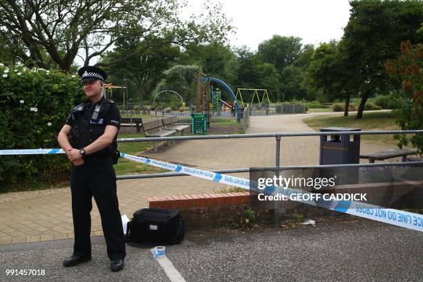 Police officer stands at a cordon at Queen Elizabeth Gardens in Salisbury, southern England, on July 4, 2018 believed to be cordoned off in relation...