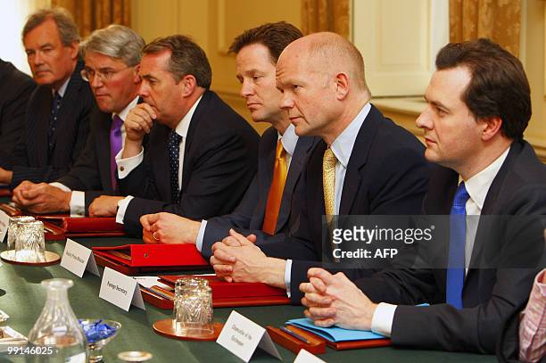 Britain's Deputy Prime Minister Nick Clegg , Foreign Secretary William Hague and Chancellor George Osborne attend the first meeting of the National...