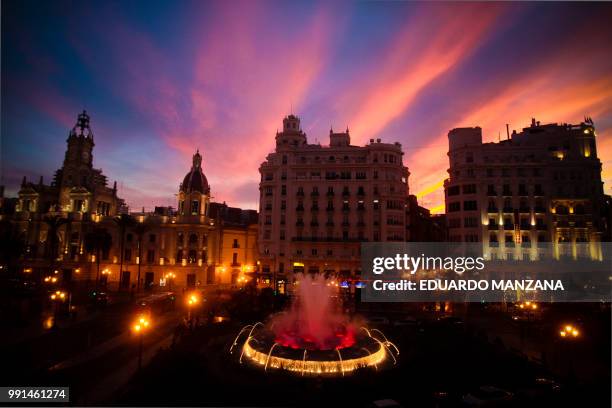 sunset in the city center of valencia - manzana stock pictures, royalty-free photos & images