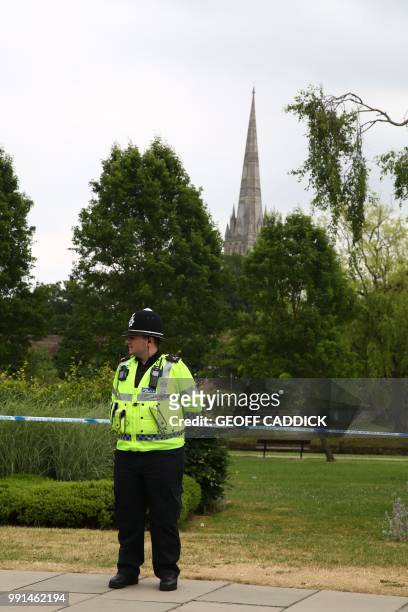 Police officer stands at a cordon outside Queen Elizabeth Gardens in Salisbury, southern England, on July 4, 2018 believed to be cordoned off in...