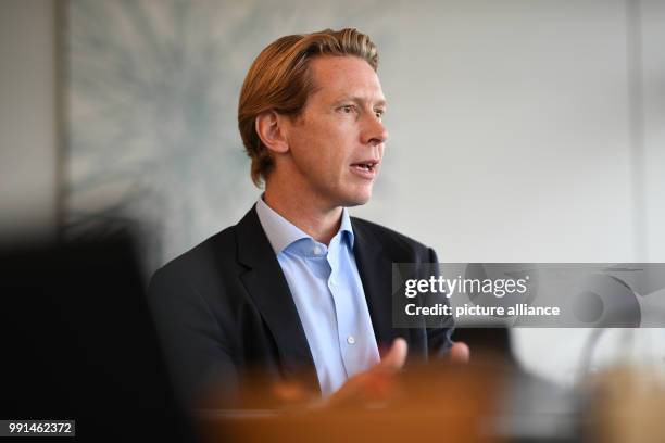 Chairman of the Ravensburg Group Clemens Maier talks in his office in the headquarters of the company in Ravensburg, Germany, 6 November 2017. Photo:...