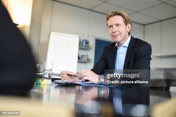 Chairman of the Ravensburg Group Clemens Maier talks in his office in the headquarters of the company in Ravensburg, Germany, 6 November 2017. Photo:...